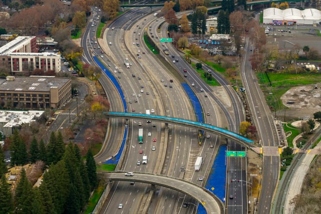 Aerial view of an urban road network and highway interchange