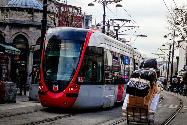 Modern tram travelling on an urban street