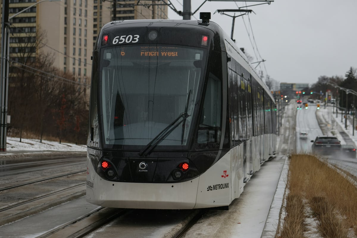 Modern tram on snow-covered tracks